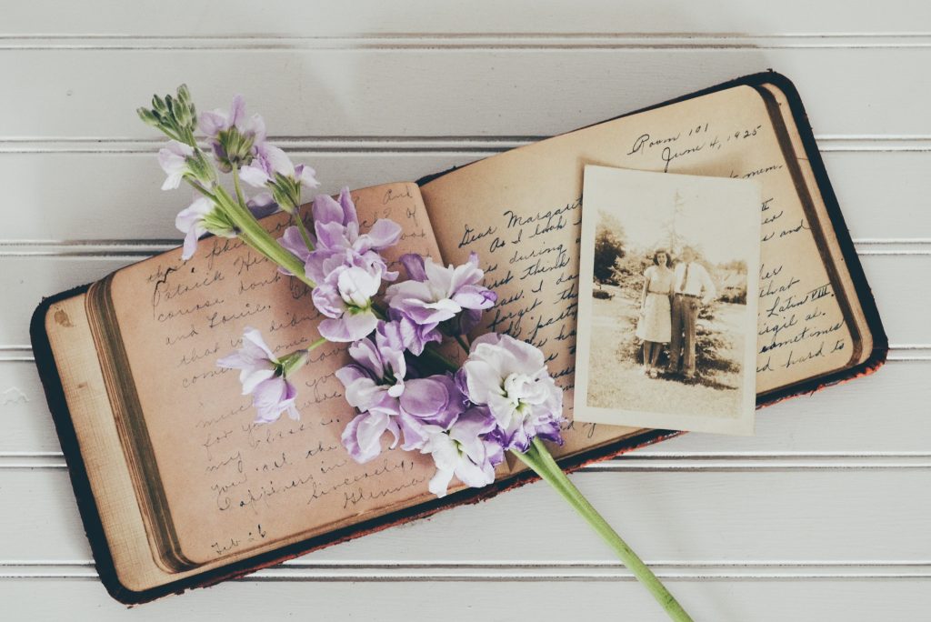antique diary and photo with flowers