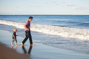 Father and son by the beach