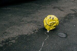 deflated smiley balloon